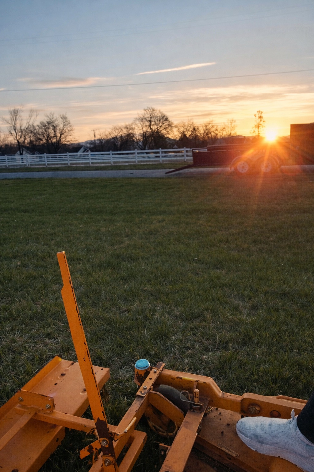 Lawn mowing at sunset in Cache Valley